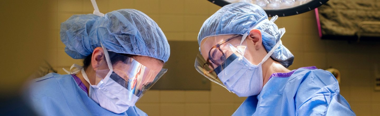 Close-up of two medical professionals during a surgical procedure