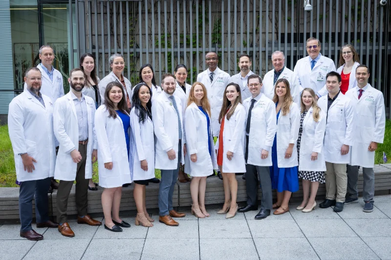Group photo of surgery residents wearing white coats
