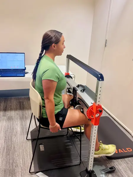 A person sitting and being evaluated in the MARS Lab