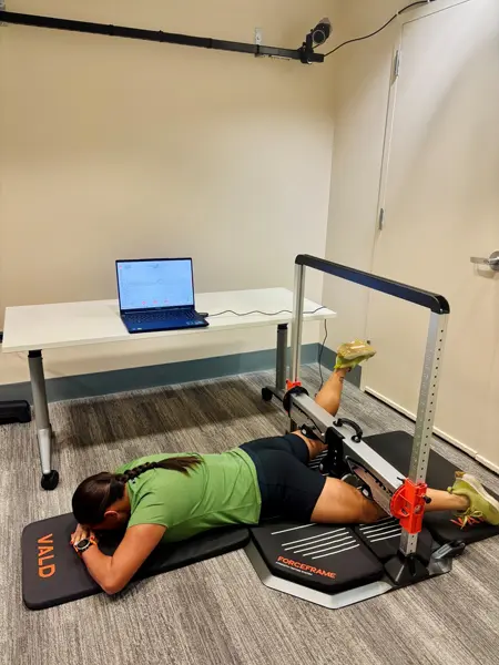 A person in the hip prone oration position being evaluated in the MARS Lab
