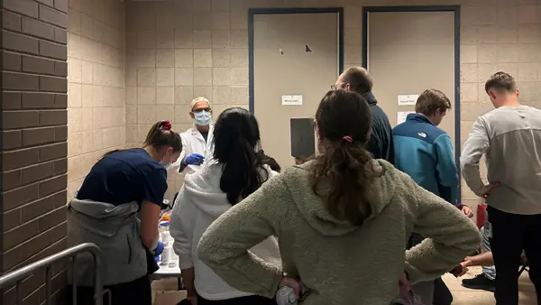 Students and staff work in the CURE Clinic