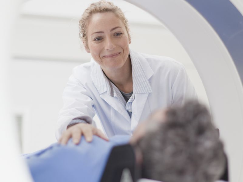 Medical Imaging Technologist providing imaging services to a patient.