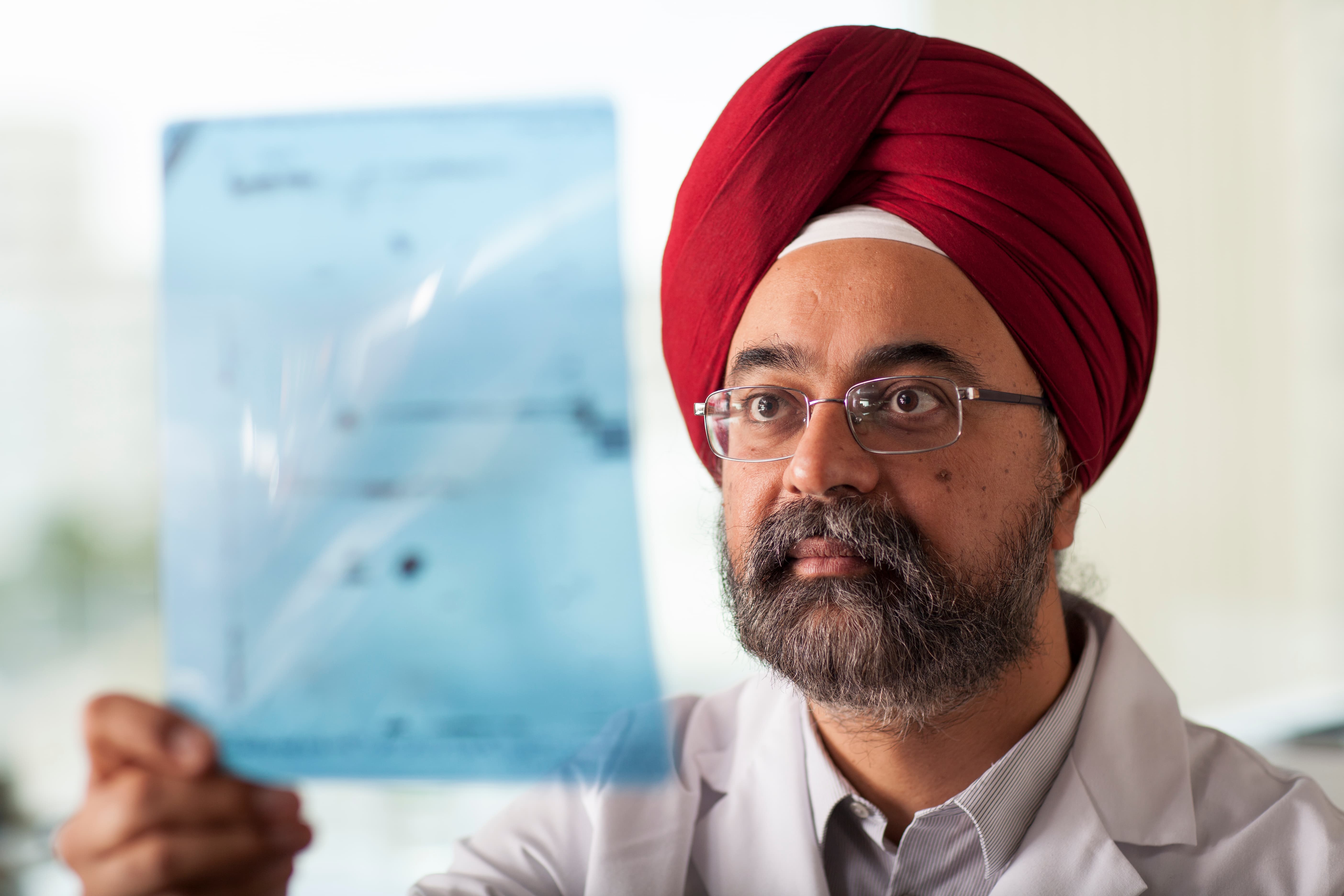 Dr. Sumant Chugh, MD, GDTL PI, analyzing two dimension gel Western-blot