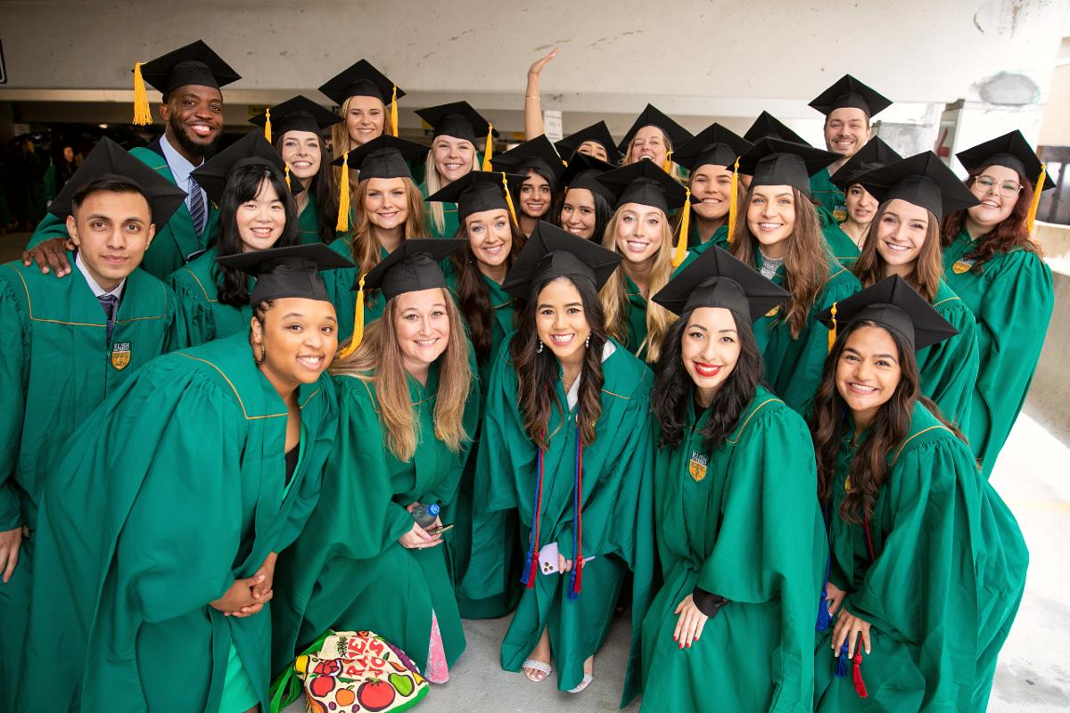 A group of students wearing graduation regalia