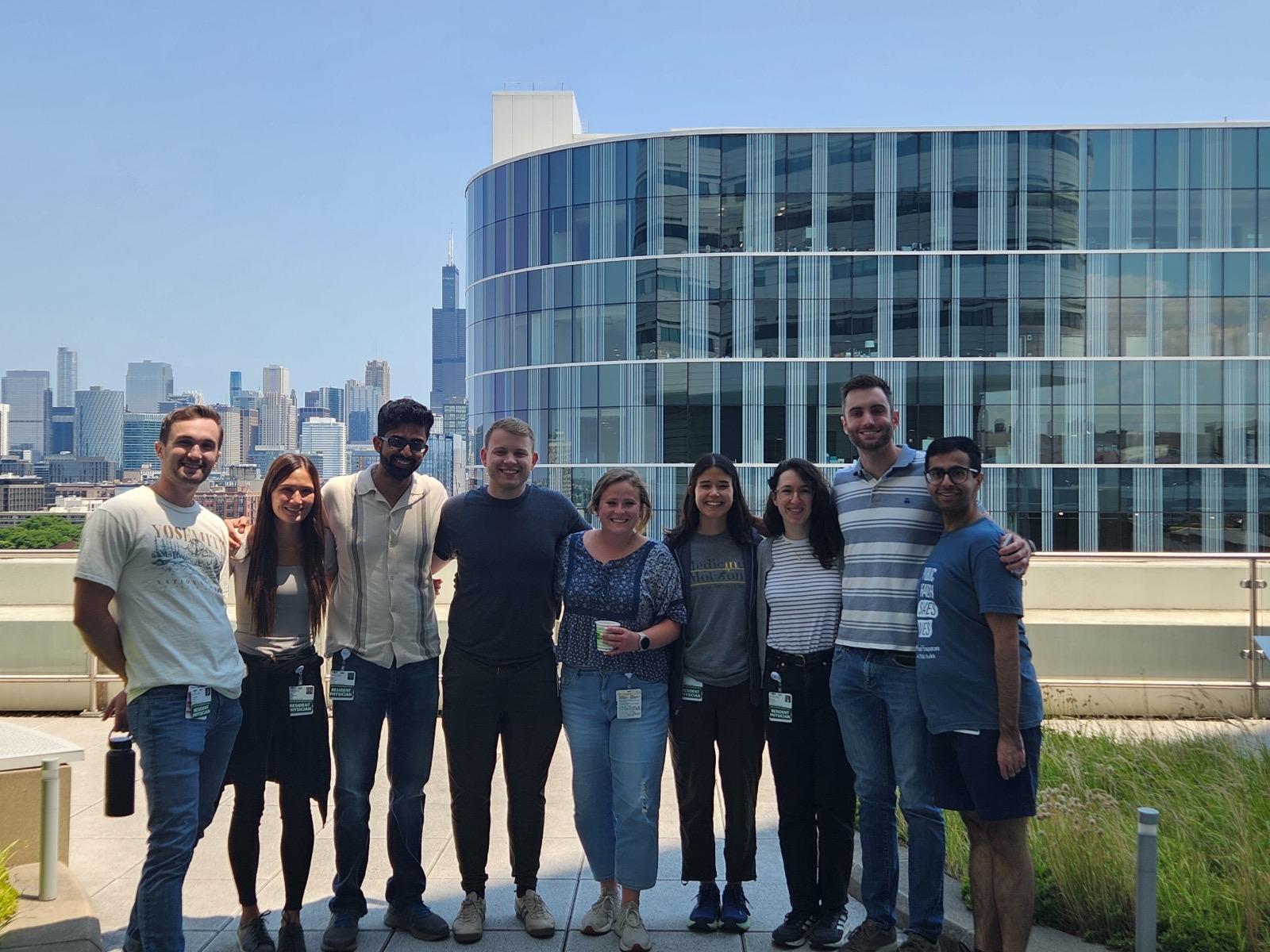 Rush University Neurology residents posing in front of the Chicago skyline.