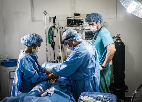 RUSH volunteer performing surgery