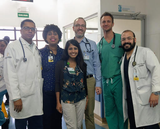 A group of doctors stand in a hospital together.