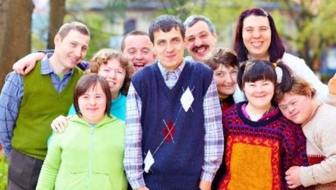A group of people with intellectual disabilities standing together outdoors