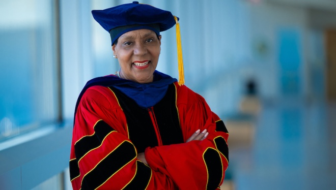 Diane Howard wearing academic regalia