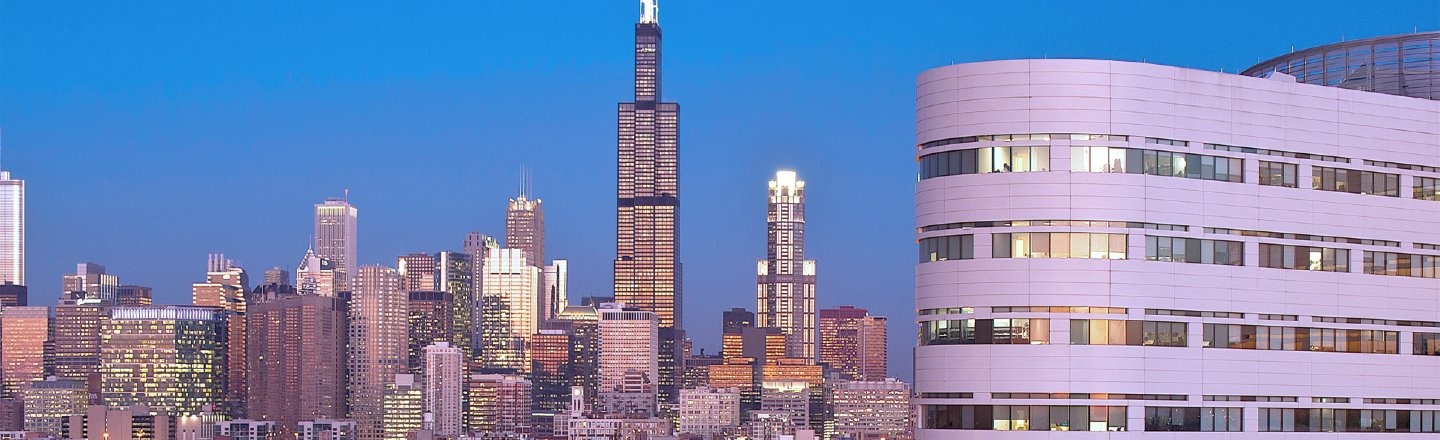 Rush Tower building and Chicago skyline at twilight
