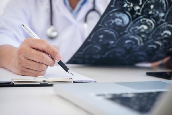 Health care provider looking at patient charts