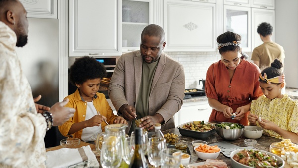 A family making a meal in a kitchen
