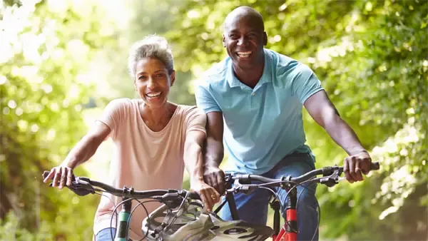 Two people riding bikes