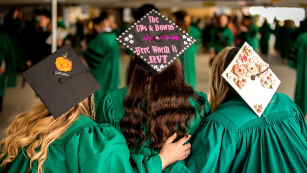 Three decorated mortarboards