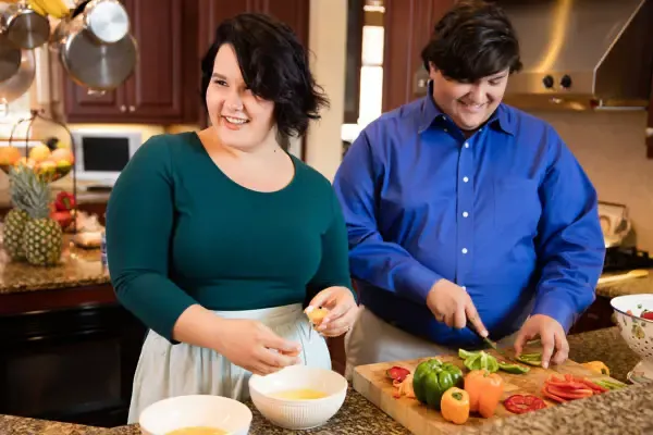 Two people preparing a meal
