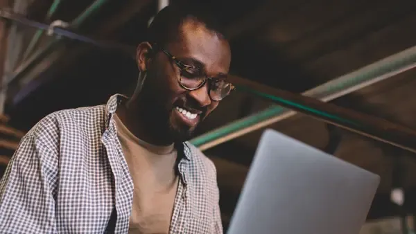 A man using a laptop computer
