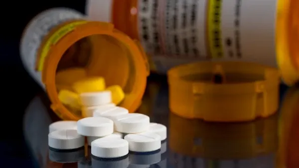 Close-up of oxycodone tablets spilling out of a prescription bottle