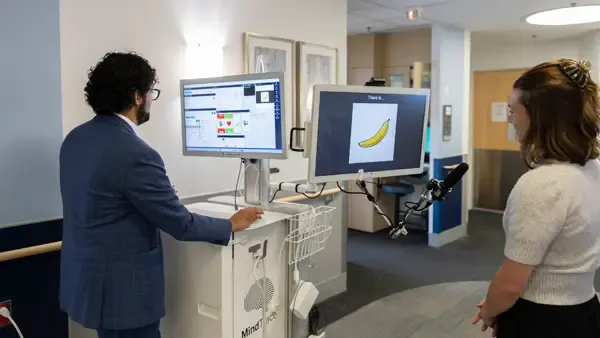 Mallela uses a MindTrace machine to gather information about how a person’s brain is functioning.