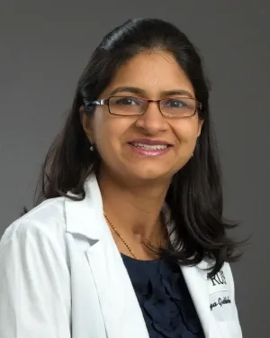 Headshot of Ramya Gaddikeri, MD, wearing a white coat
