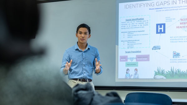 A Rush University faculty member giving a lecture to students