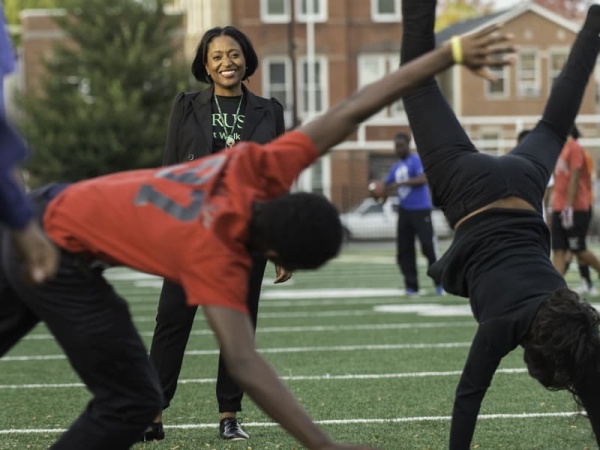 Monique Reed Crane cheers on residents of Chicago's West Side.