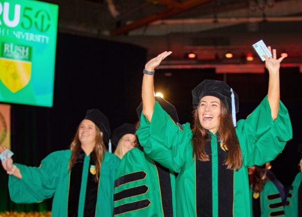 Rush University graduates celebrating. 