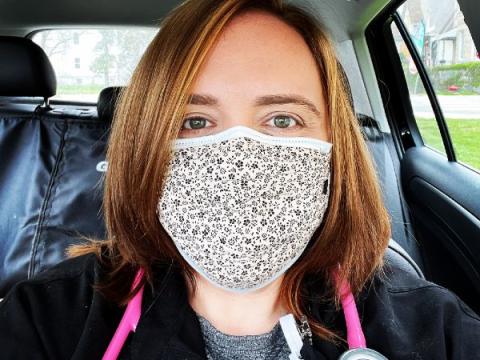 Close-up photo of Melissa Kalensky wearing a mask while seated in a car