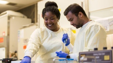 Two workers in a lab