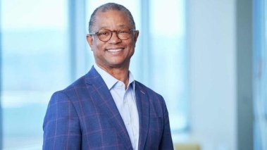 Ted Love smiles on Rush University's campus ahead of the 54th Commencement Ceremony. 